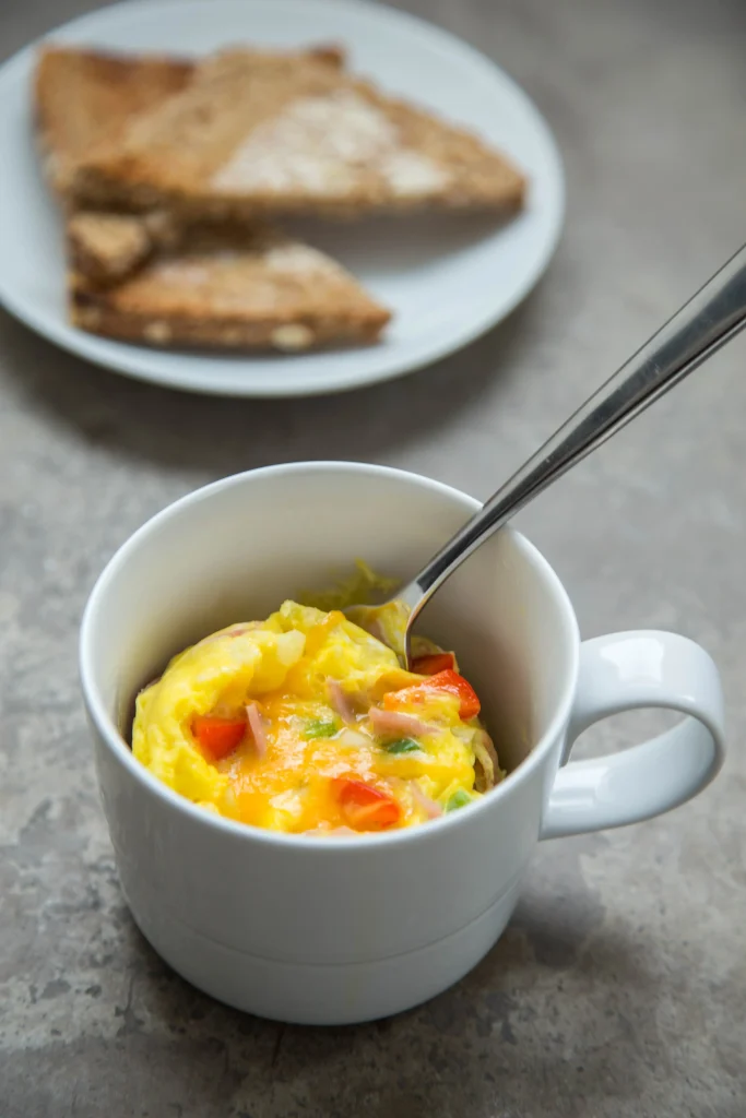 Egg in mug with vegetables